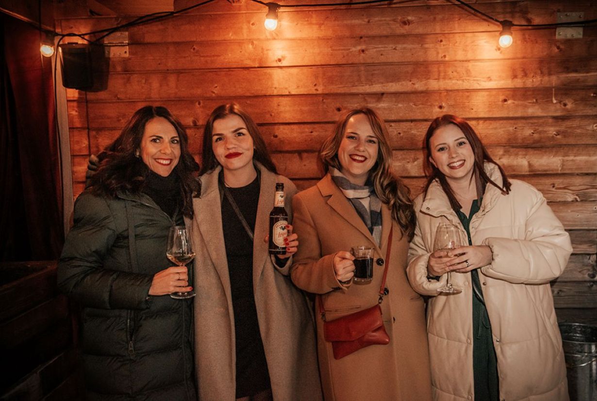 Group of four women in a Christmassy atmosphere