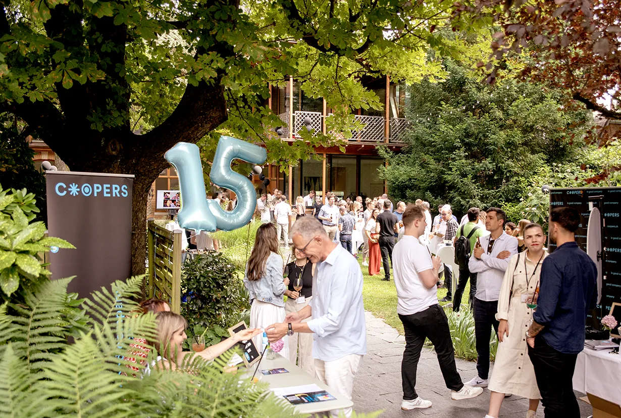Guests at the Coopers Summer Apéro 2025 in the garden of Orangerie Basel